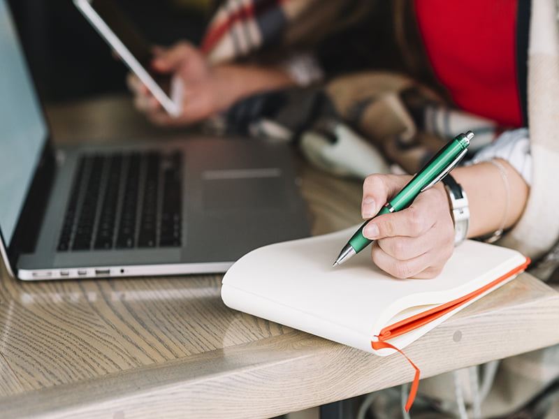 businesswoman writing coffee shop